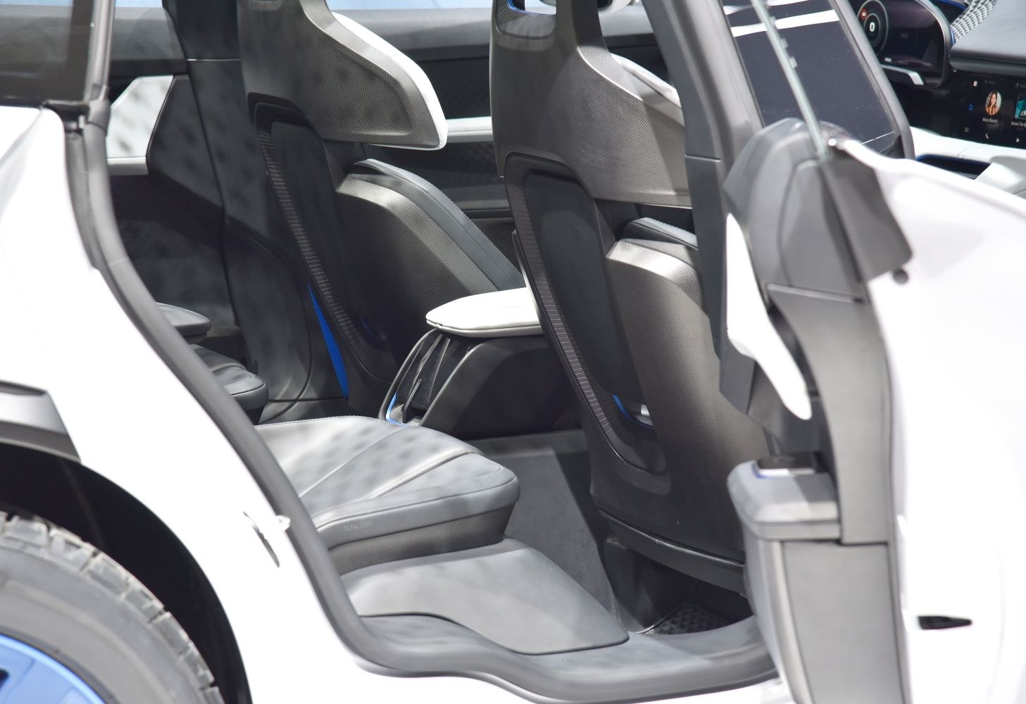 Rear passenger seats and interior design with open door