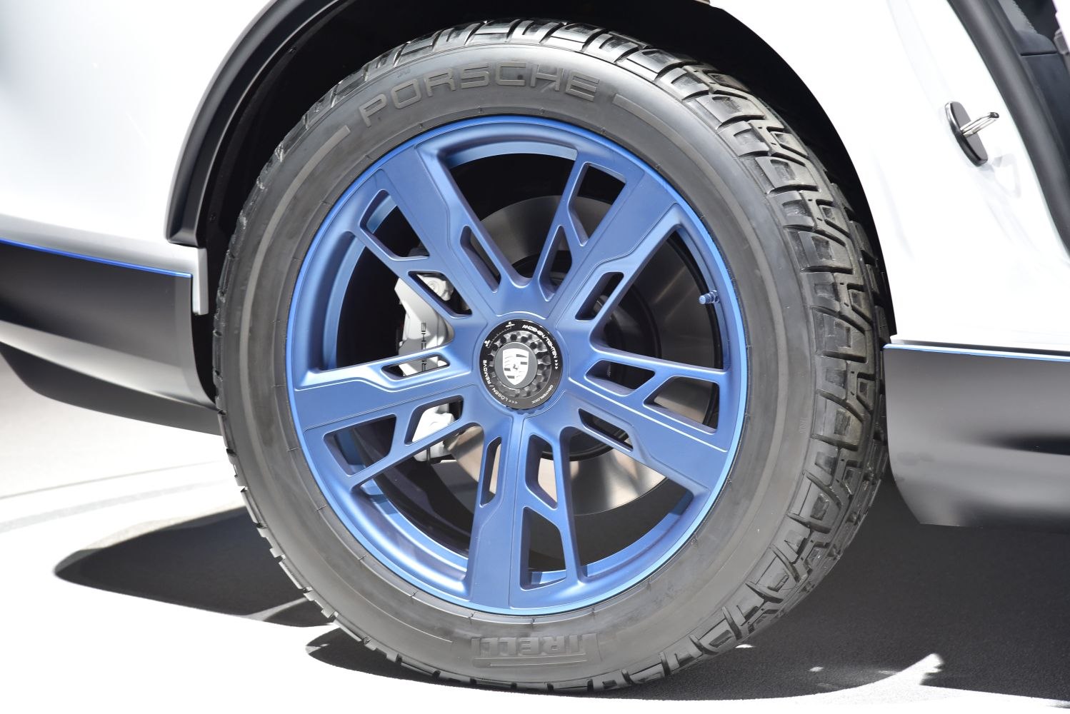 Blue multi-spoke alloy wheel with Pirelli tire