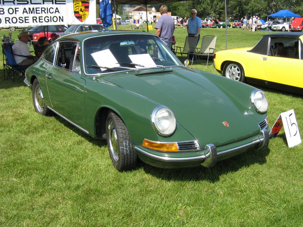 Vintage sports car with round headlights and chrome bumper