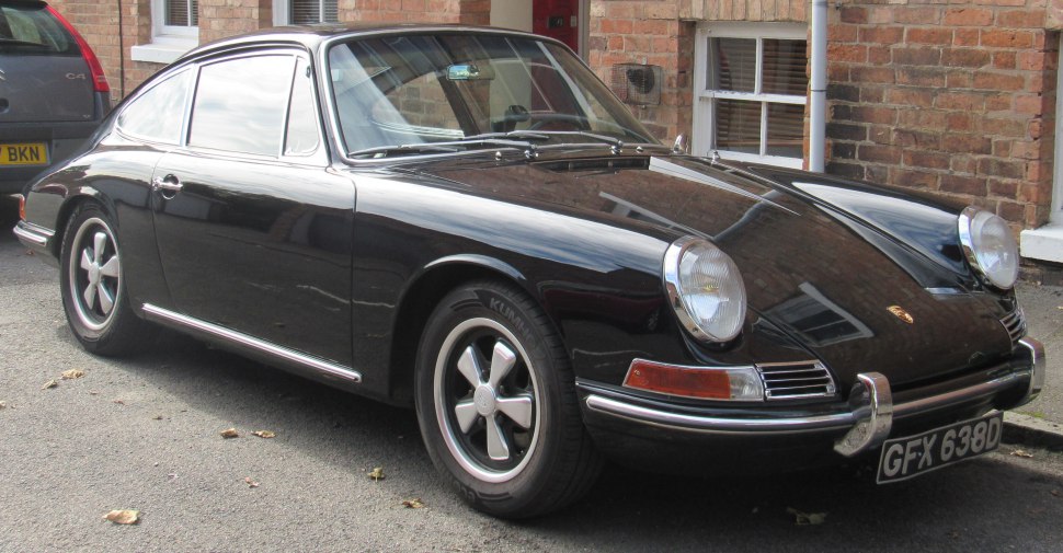 Classic black coupe with Fuchs wheels and round headlights