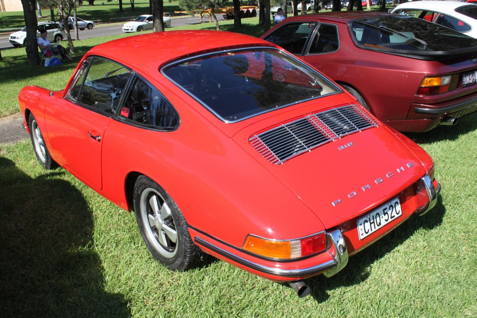 Rear view of classic coupe with rear grille and round taillights