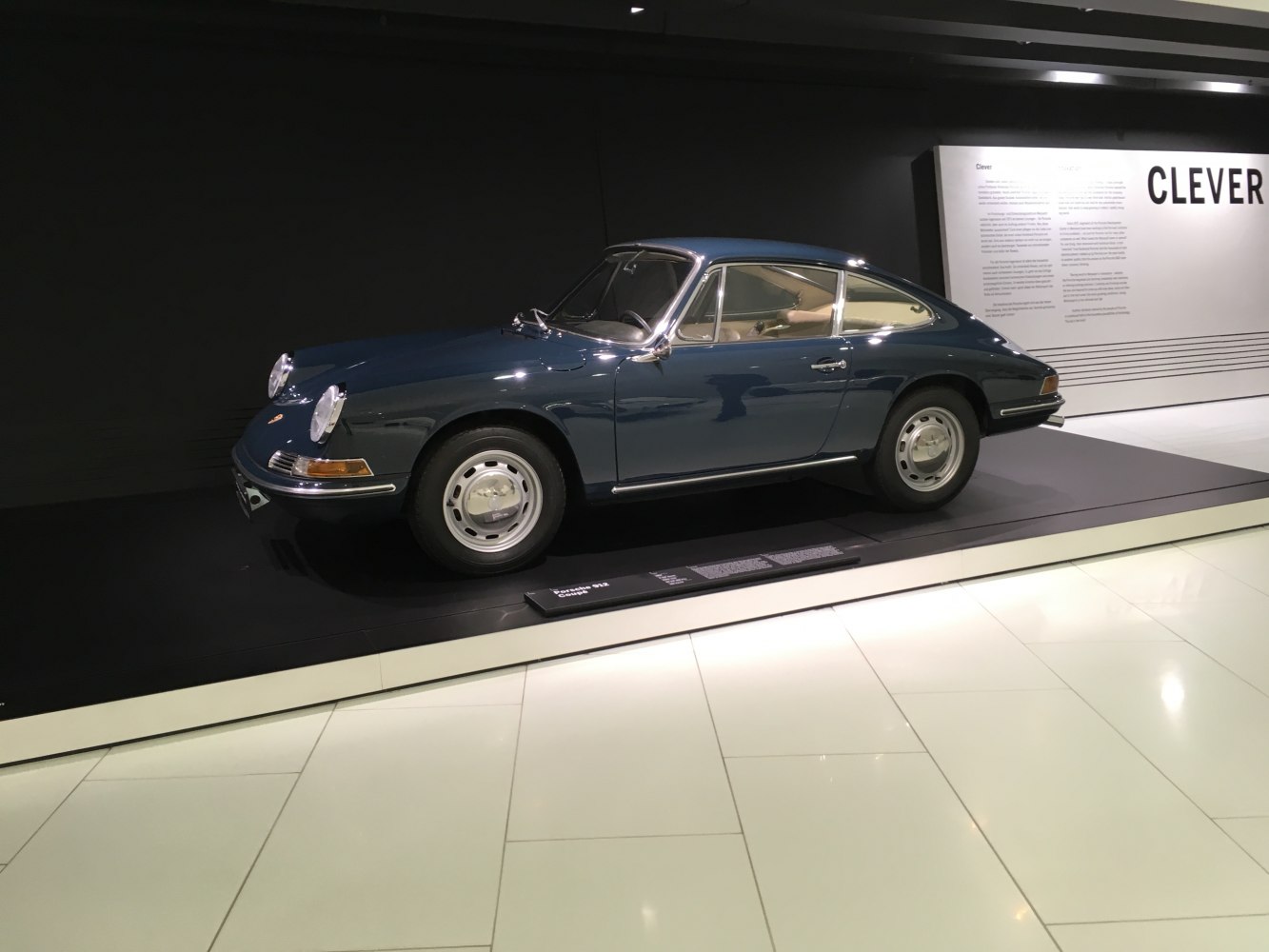 Classic sports coupe with round headlights and chrome side trims