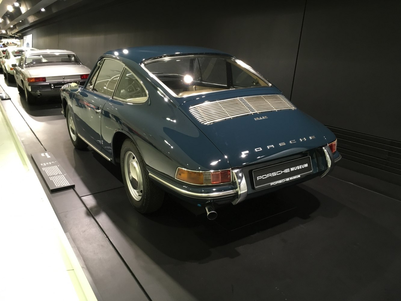 Classic Porsche 912 rear view with unique tail lights and rear grille.
