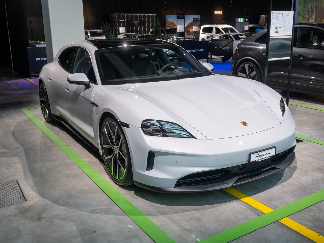 Front three-quarter view of sleek electric luxury sport sedan.