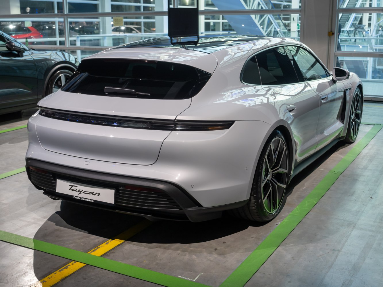 Rear view of electric Sport Turismo with sleek LED tail light strip.