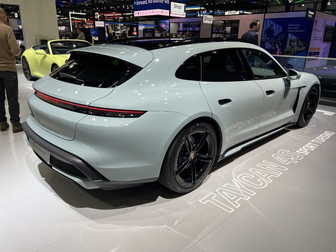 Rear and side view of electric performance wagon with sleek design and LED light bar