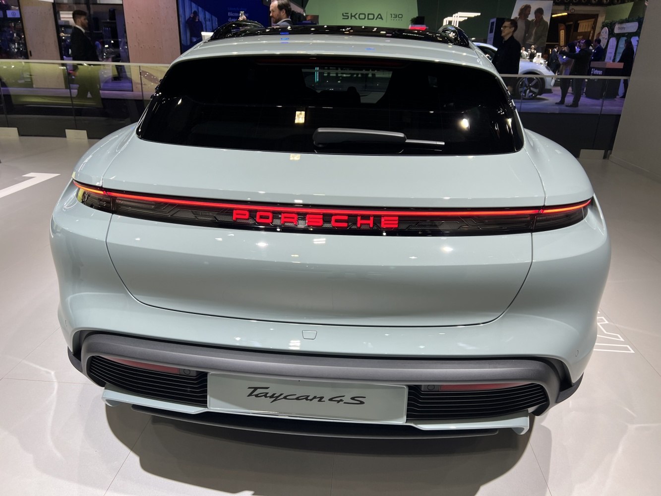 Sleek rear with illuminated Porsche badge and wide tail light strip
