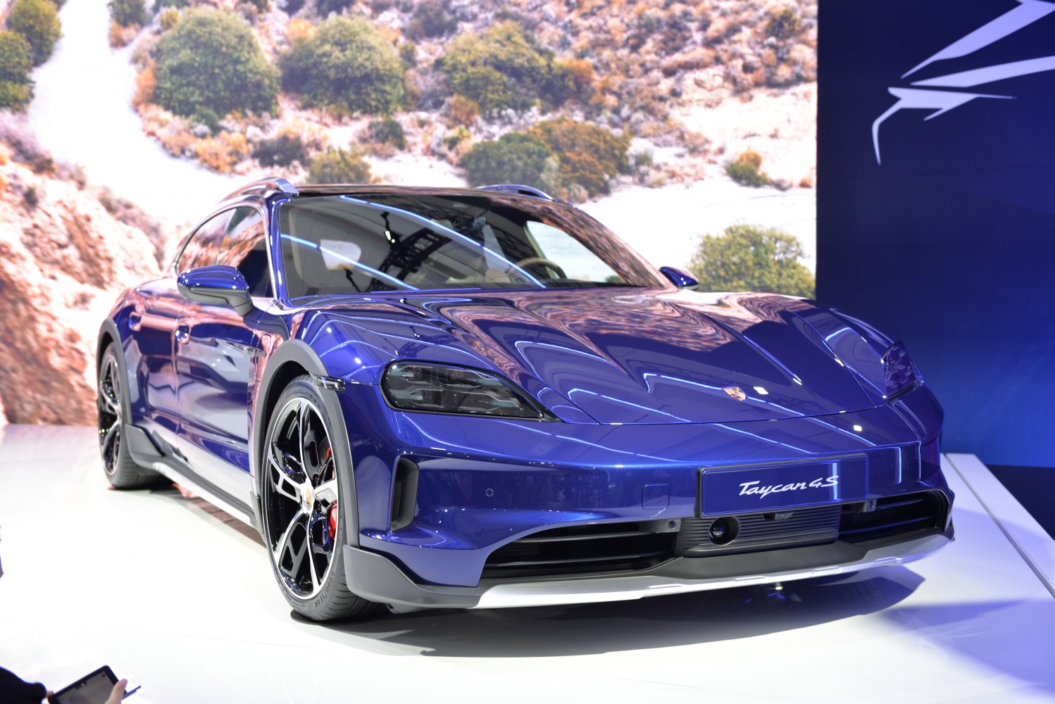 Front view of electric Porsche with sleek headlights and aerodynamic design