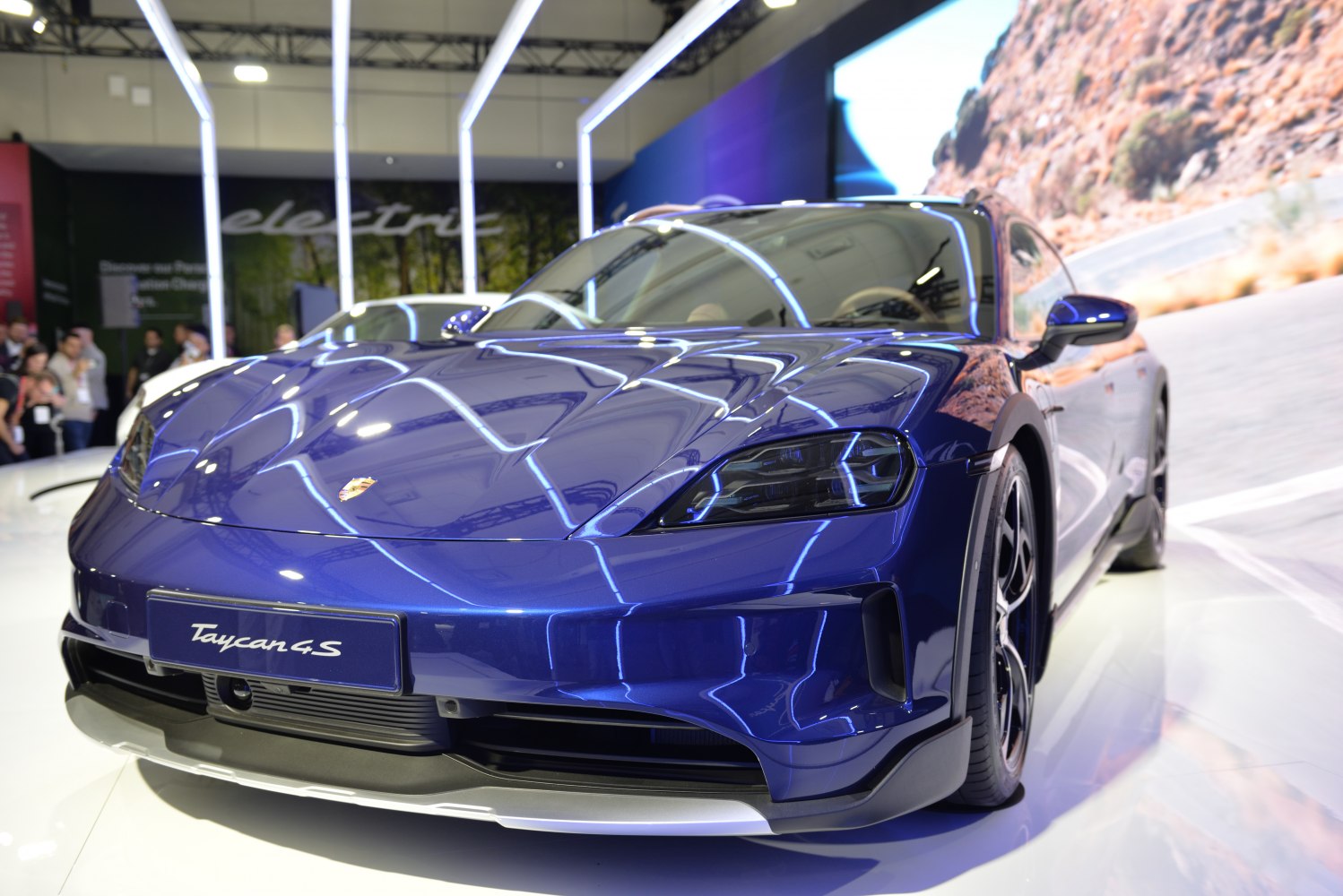 Front view with LED headlights and aerodynamic bumper of a sleek electric sports vehicle.