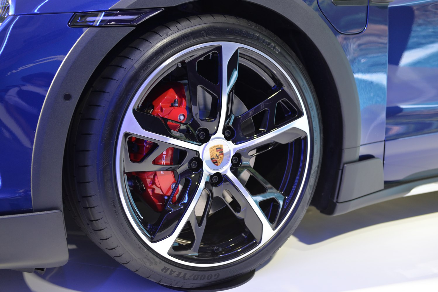 Alloy wheel with red brake caliper on a modern electric vehicle