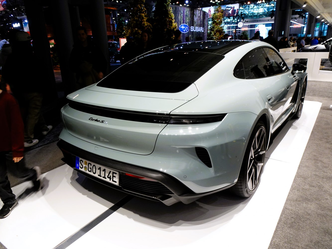 Rear view of sleek electric sports sedan with Turbo S badge and aerodynamic styling