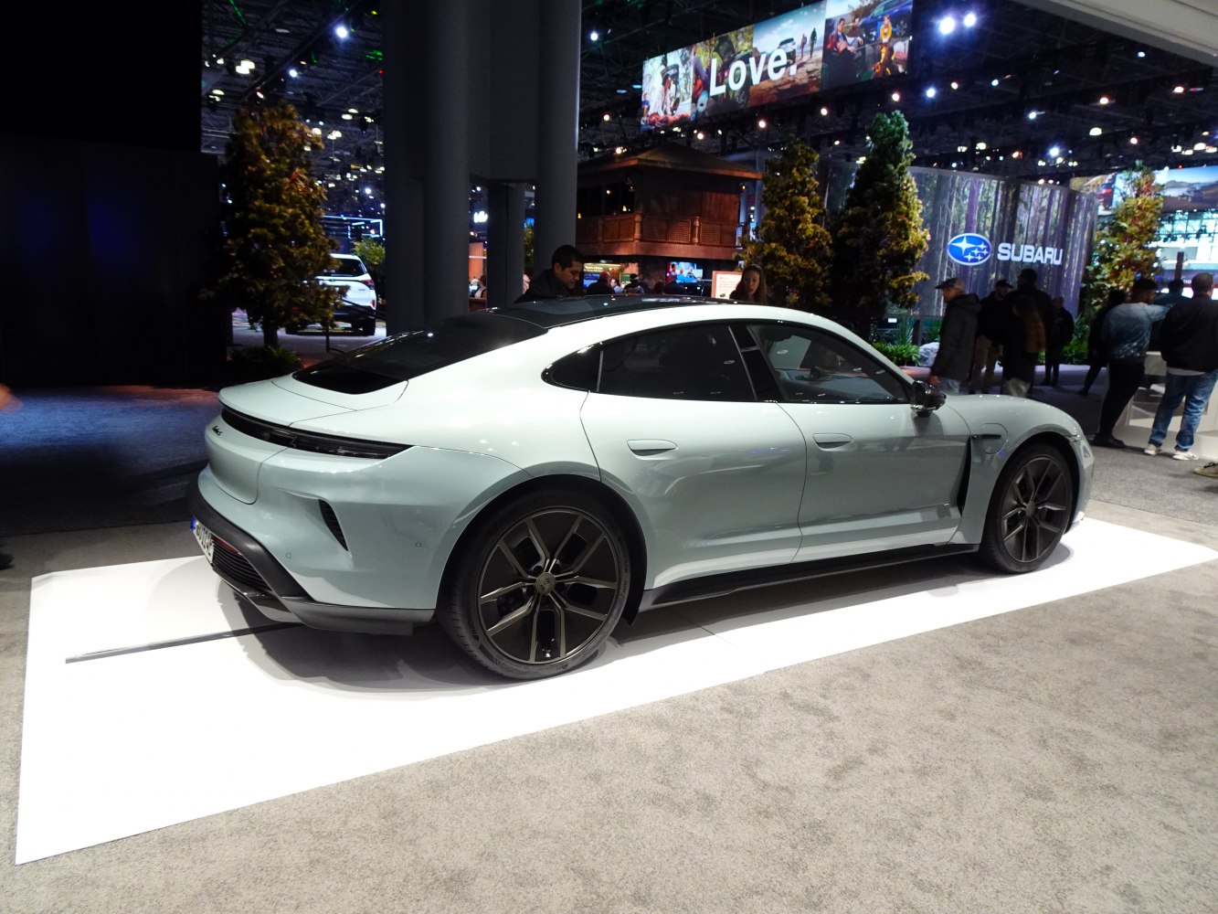 Rear and side view of sleek electric sedan with alloy wheels