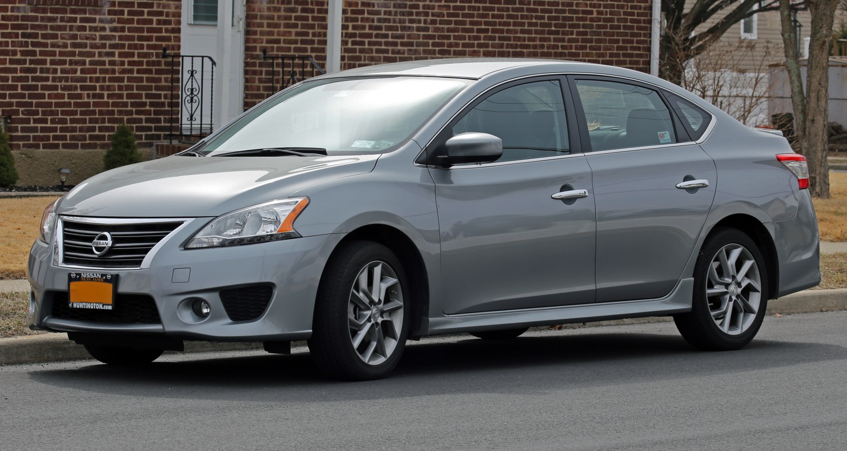Silver sedan with front and side view, alloy wheels