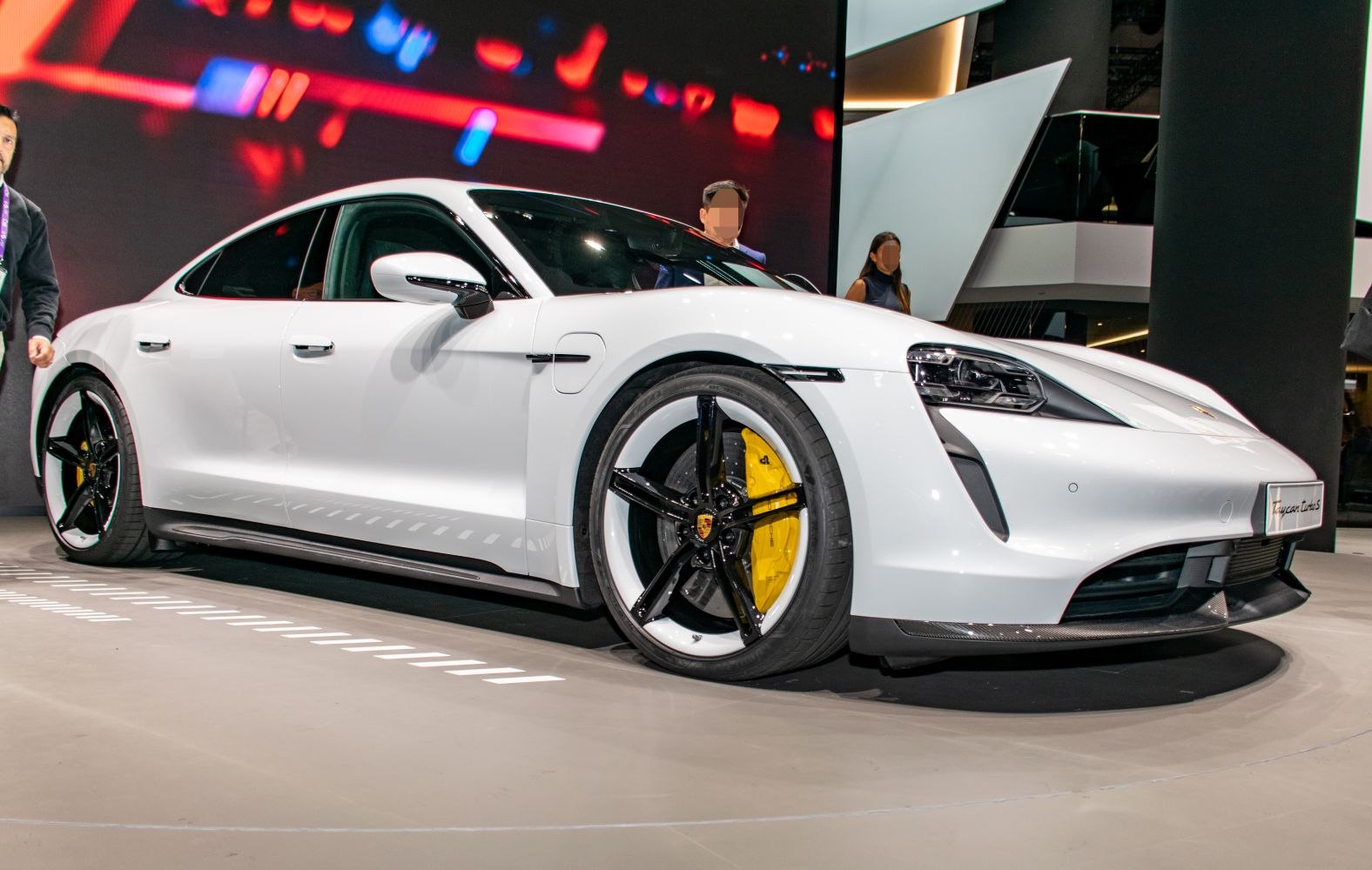 Front side view with LED headlights and black-white wheel design