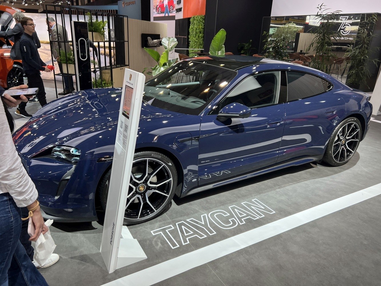 Electric sports sedan with alloy wheels and black roof