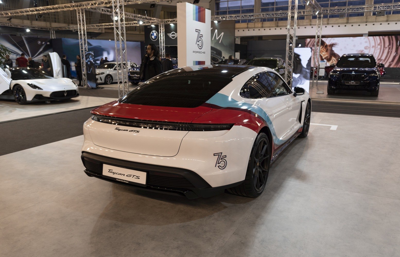 Rear view of an electric sports sedan with distinct 75th anniversary design elements