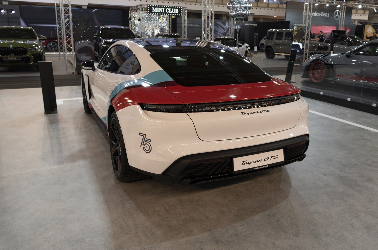 Electric sports sedan rear with aerodynamic coupe shape and unique multi-color rear design