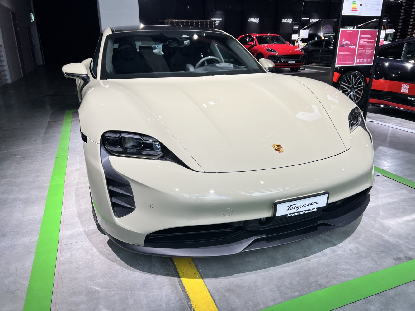 Front view of sleek electric sports car with distinctive headlights and aerodynamic design