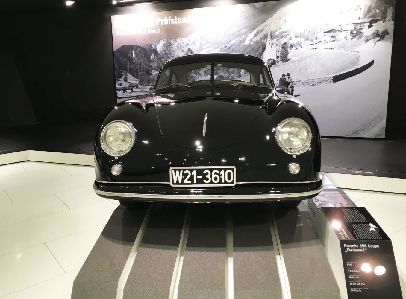 Classic vintage car front with rounded headlights and streamlined hood