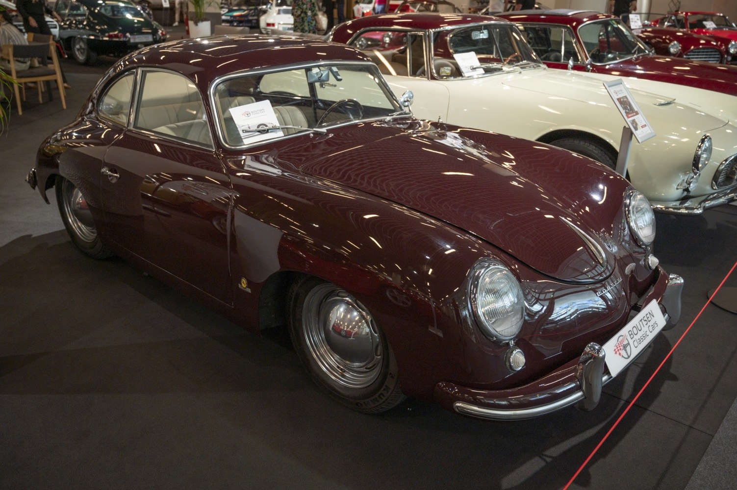 Front-side vintage coupe with rounded headlights and smooth curved design