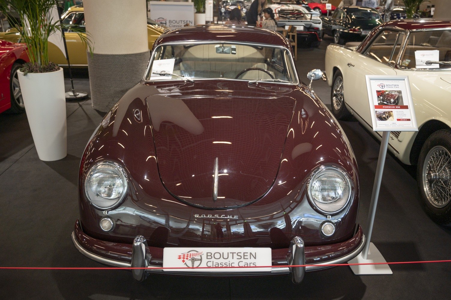 Front view of vintage coupe with round headlights and curved hood