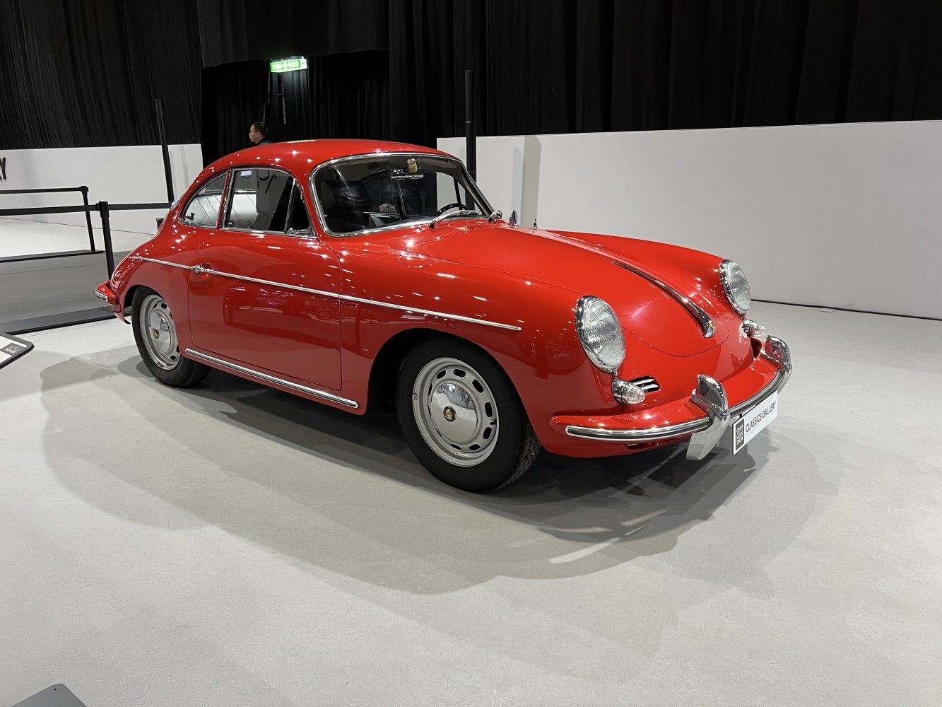 Rounded front fenders and smooth side profile of a classic coupe.
