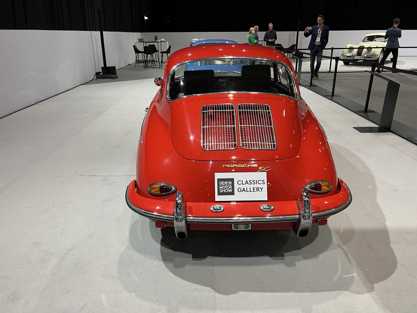 Rear view of vintage Porsche 356 Coupe with distinctive dual engine grilles and classic tail lights.