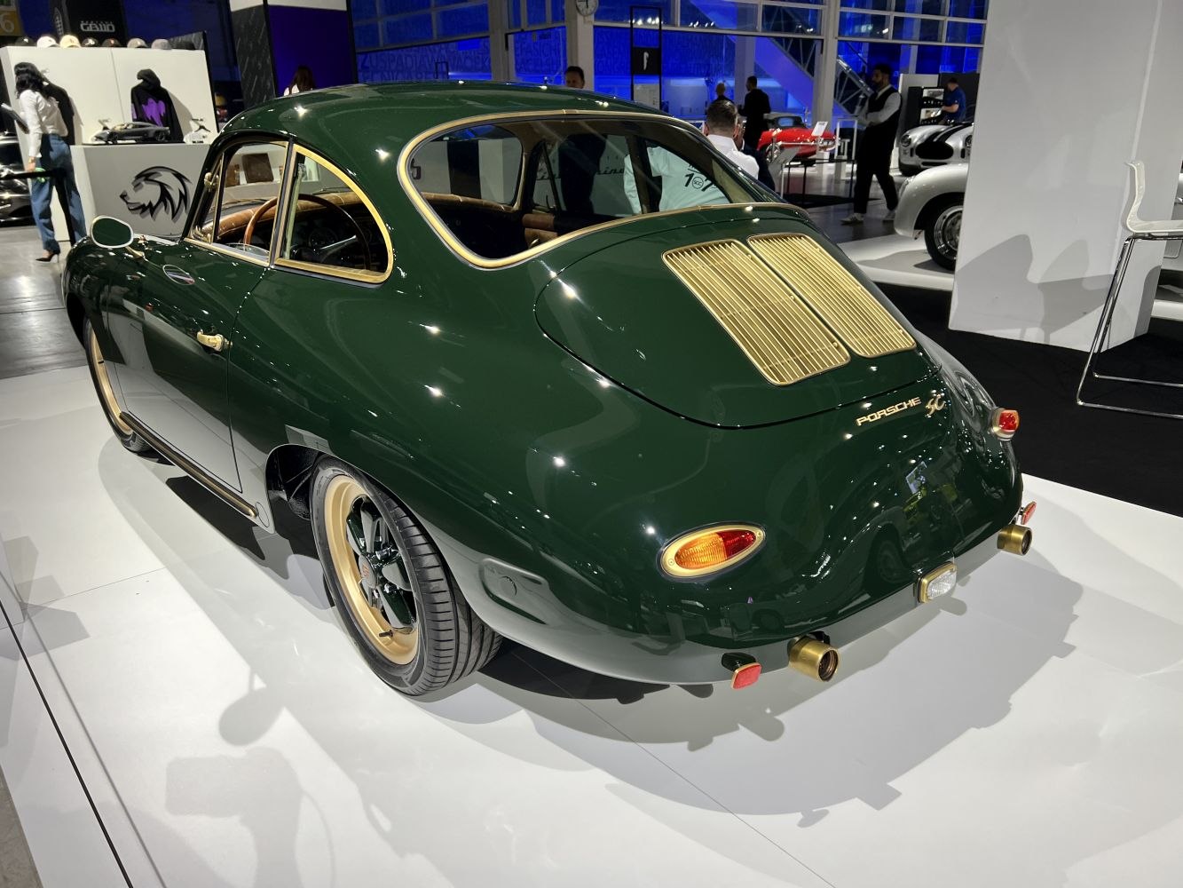 Vintage coupe rear view with gold-accented vents and trim