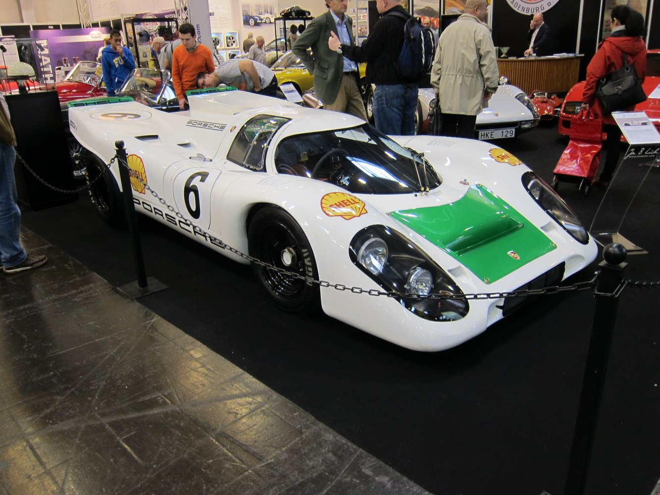 Aerodynamic racing prototype with number 6 decal and distinctive green hood