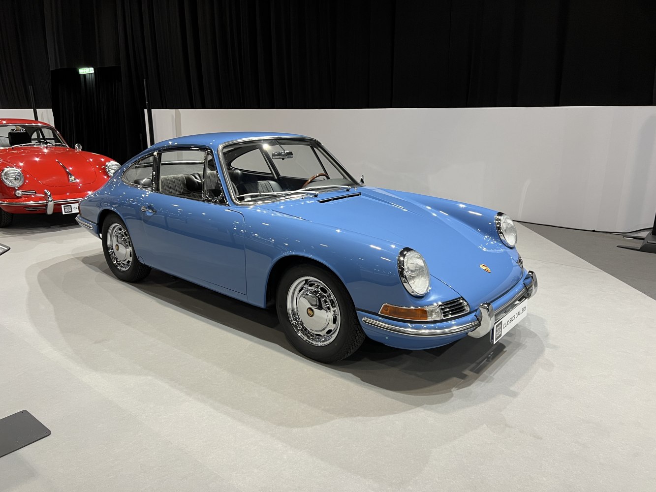 Front side profile with iconic round headlights and chrome details