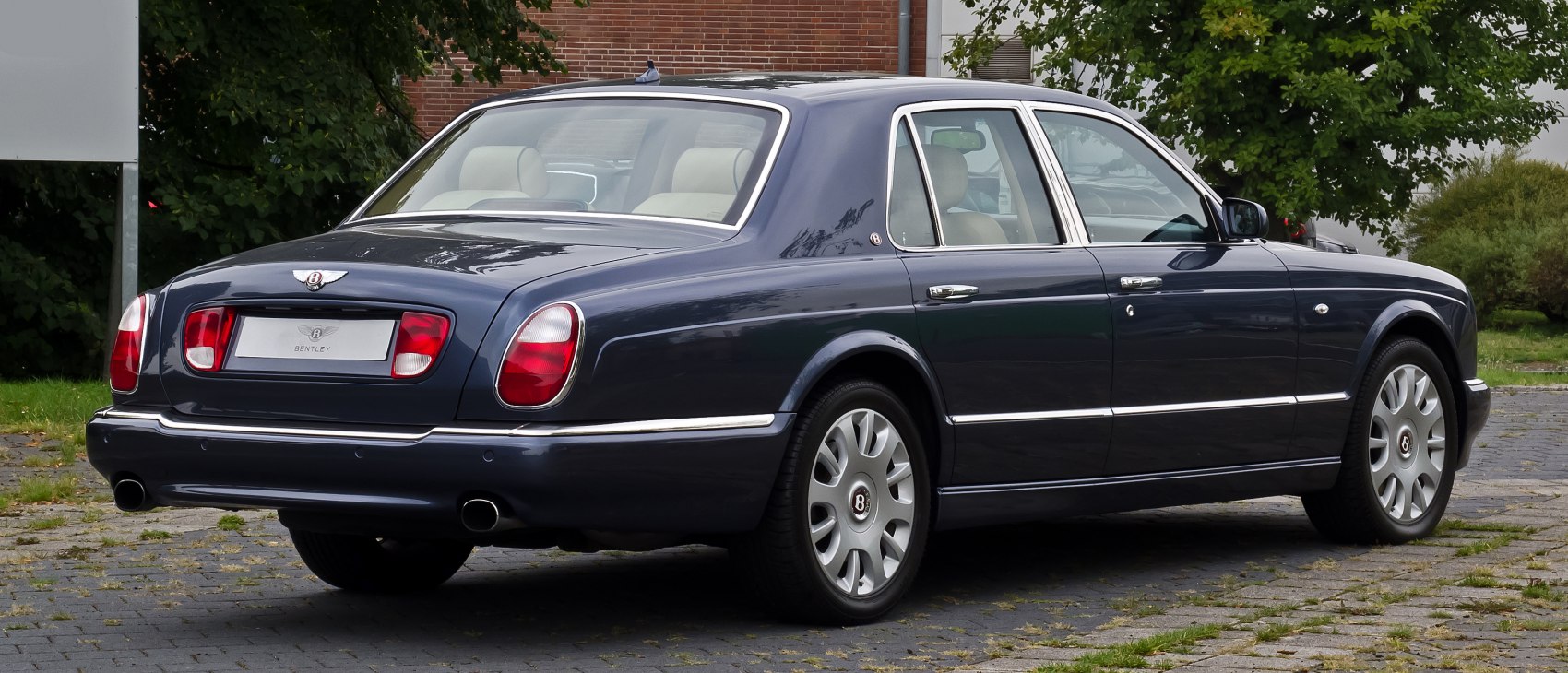 Rear three-quarter view with distinct tail lights and dual exhausts