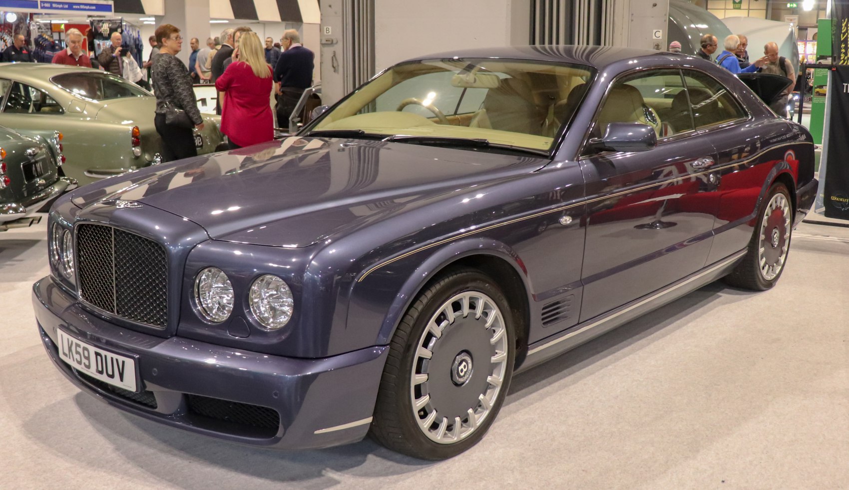 Luxury coupe front side with classic design and premium wheels