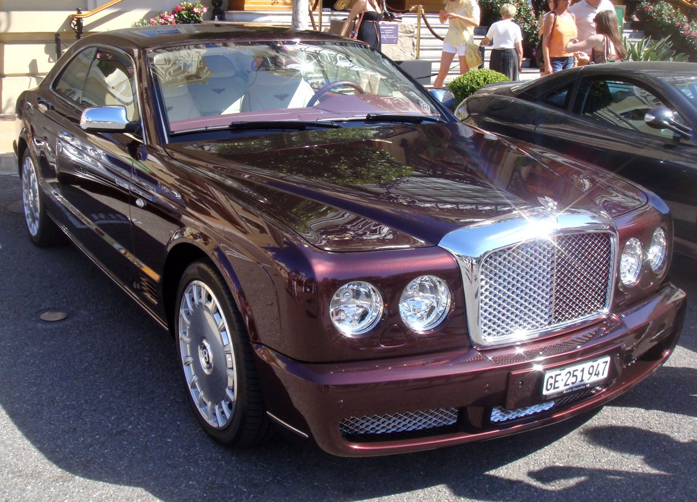 Large chrome grille and dual round headlights on a luxury sedan