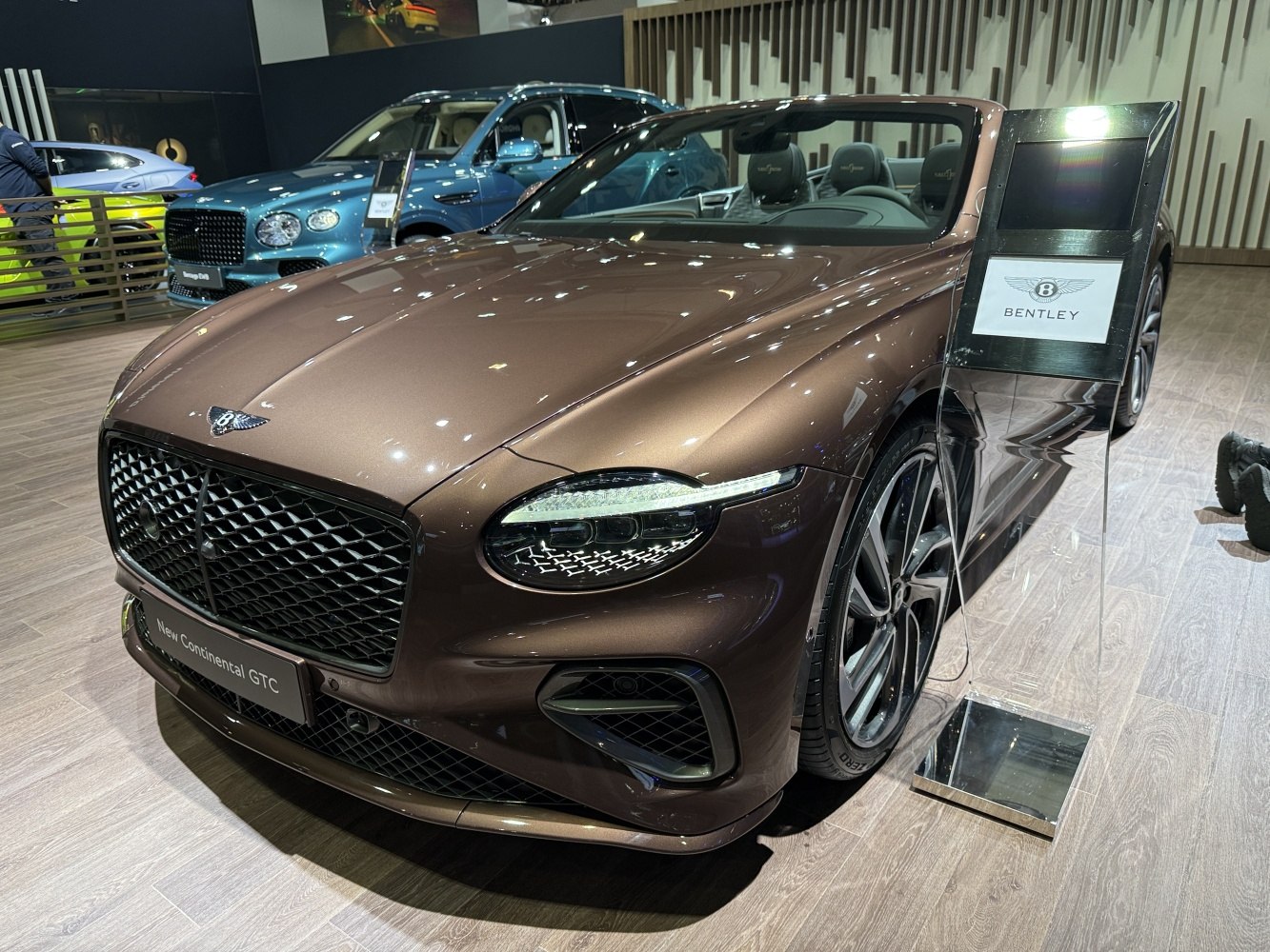 Luxury convertible with LED headlights and bold mesh grille close-up