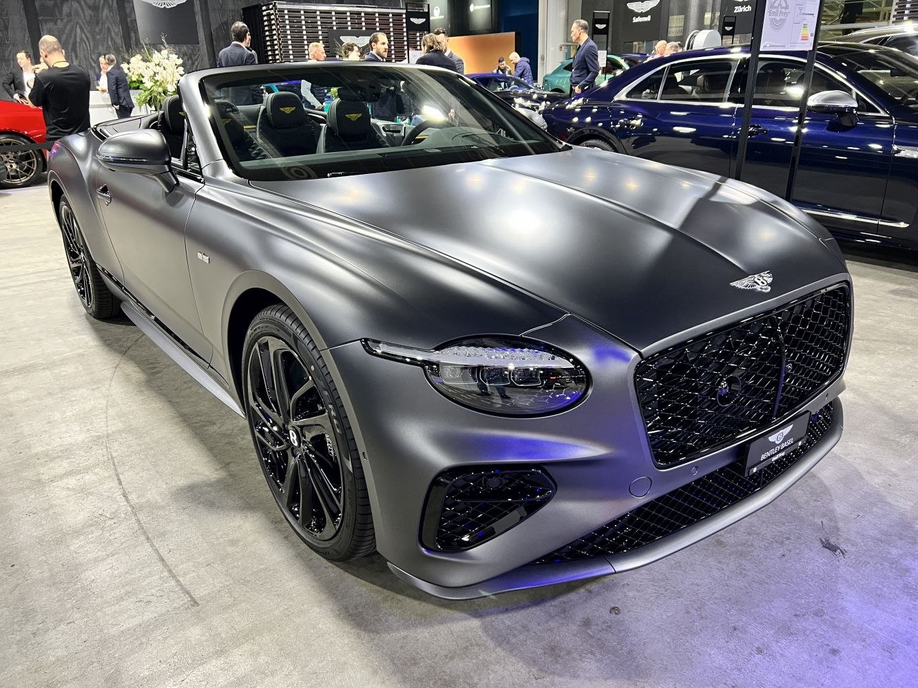 Matte finish convertible with black alloy wheels and distinctive front grille