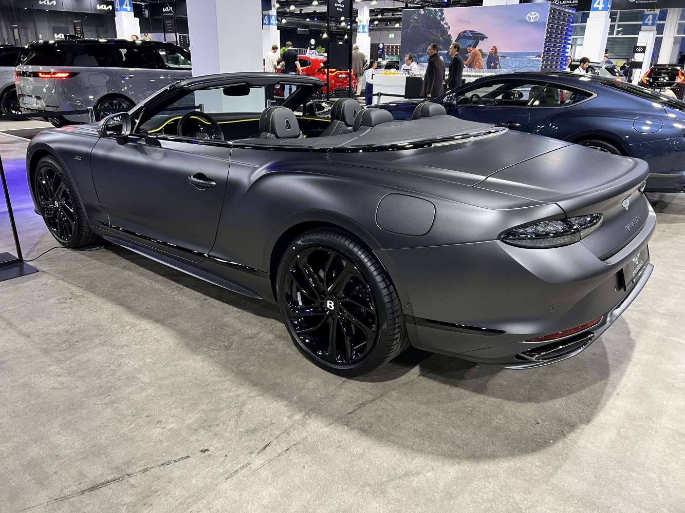 Sleek matte convertible with black wheels and luxury interior accents