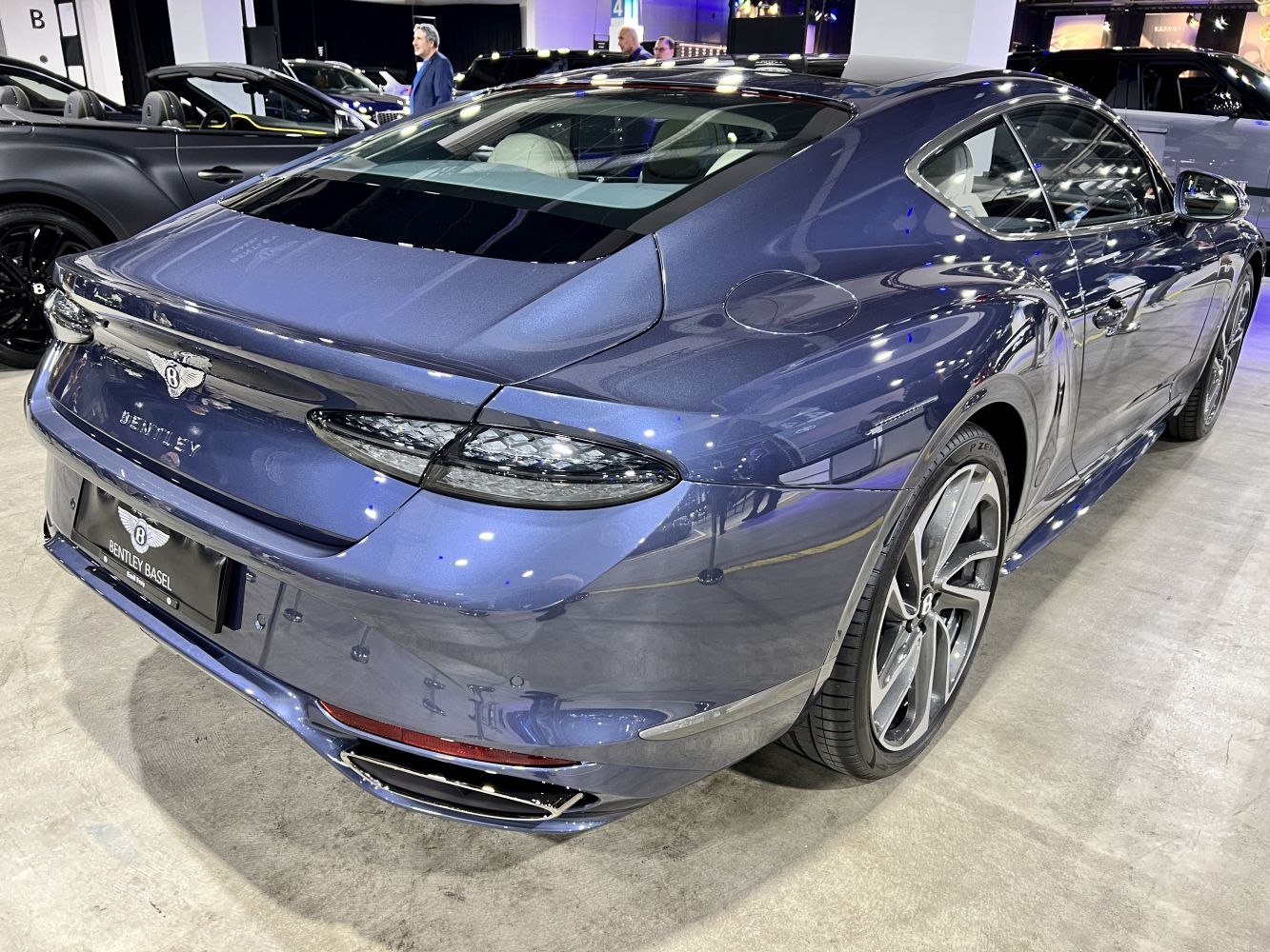 Rear view and tail lights of a sleek luxury sports coupe