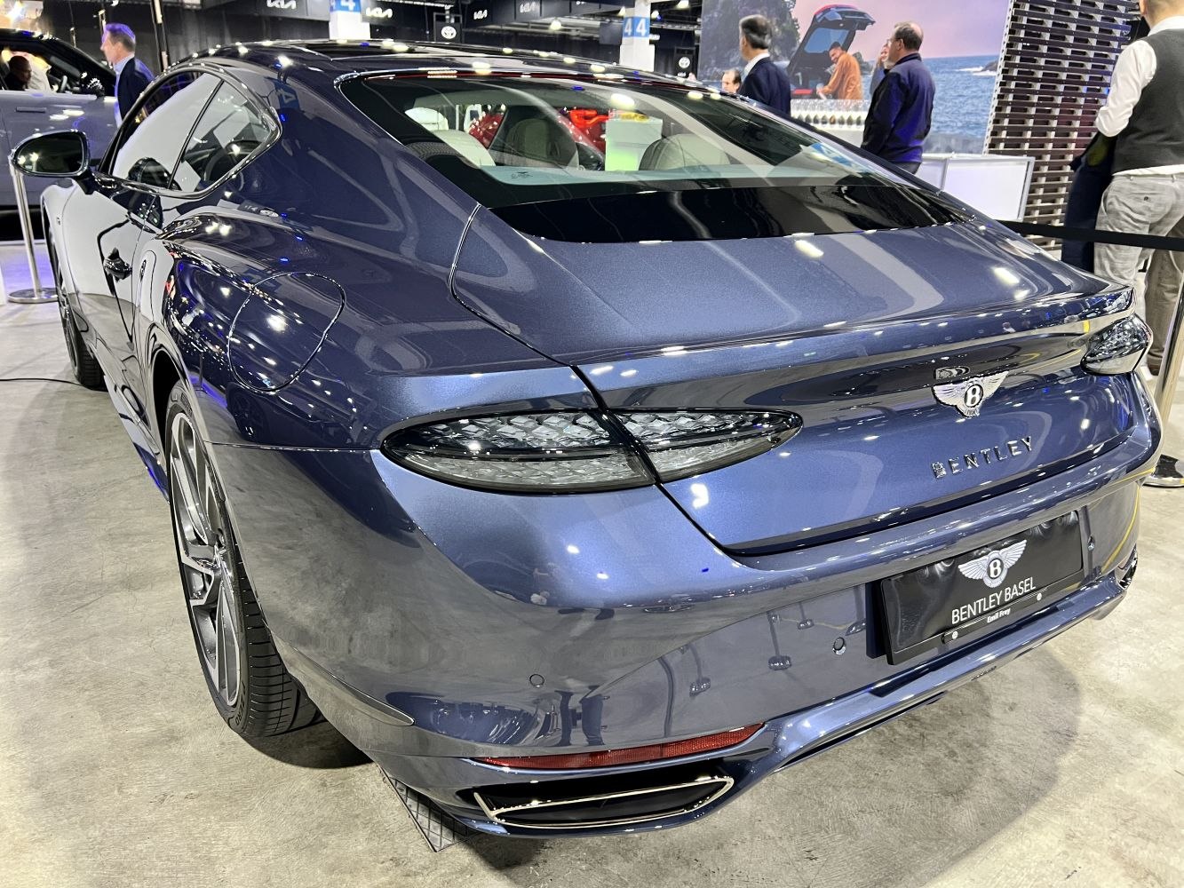Sleek luxury rear design with distinctive tail lights