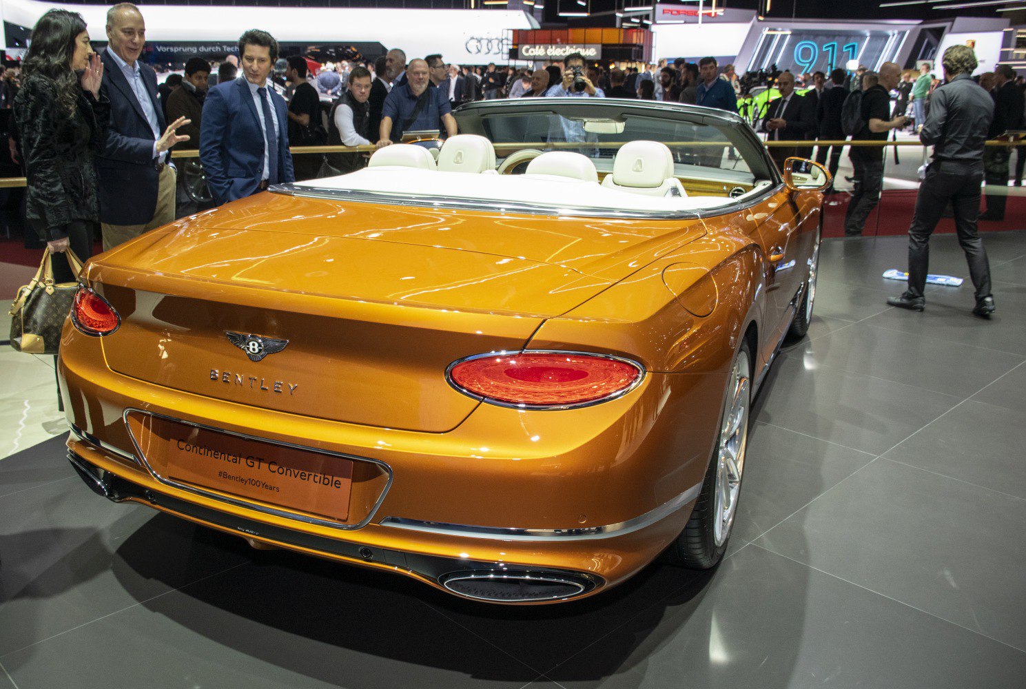 Rear view of luxury convertible with sleek taillights and open roof
