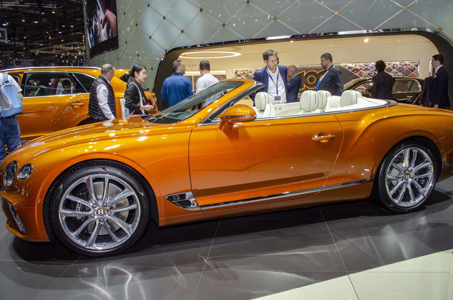 Convertible with chrome wheels and white leather interior seats