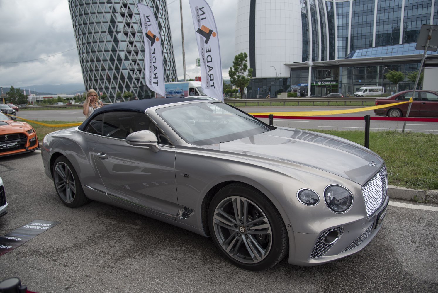 Silver convertible with dual round headlights and prominent grille