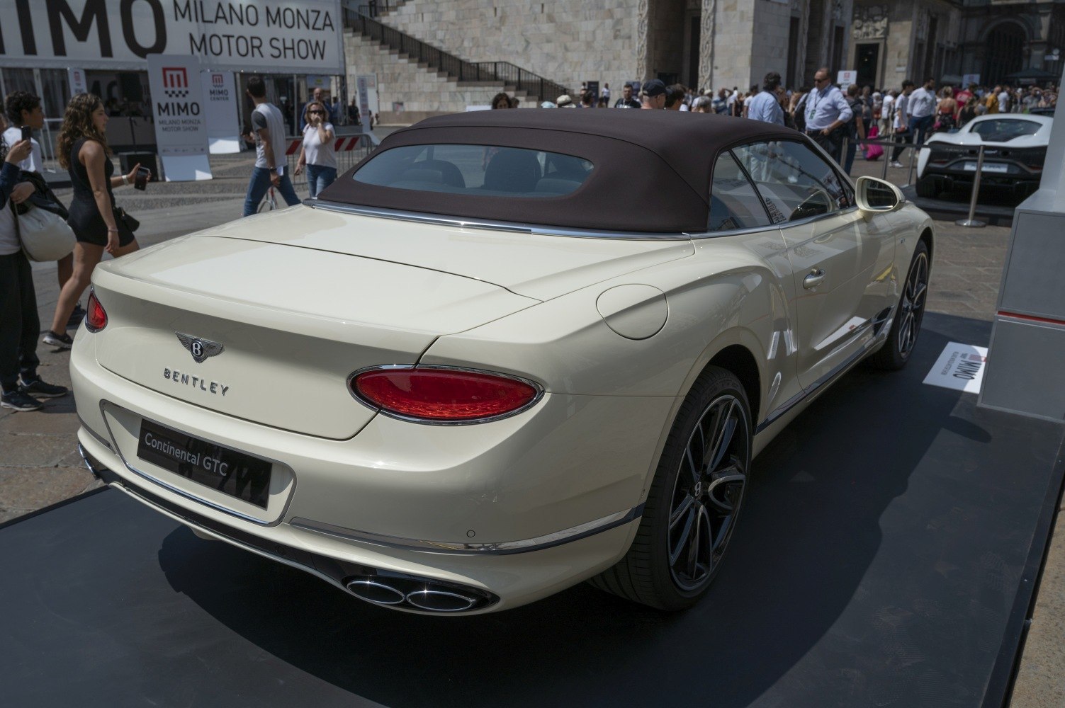 Rear view of convertible with soft-top roof and quad exhaust tips