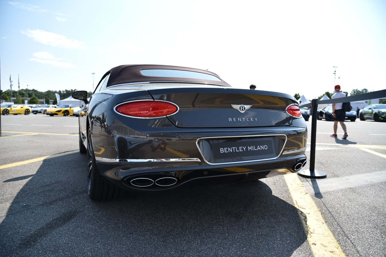 Luxury convertible rear with oval taillights and quad exhaust tips
