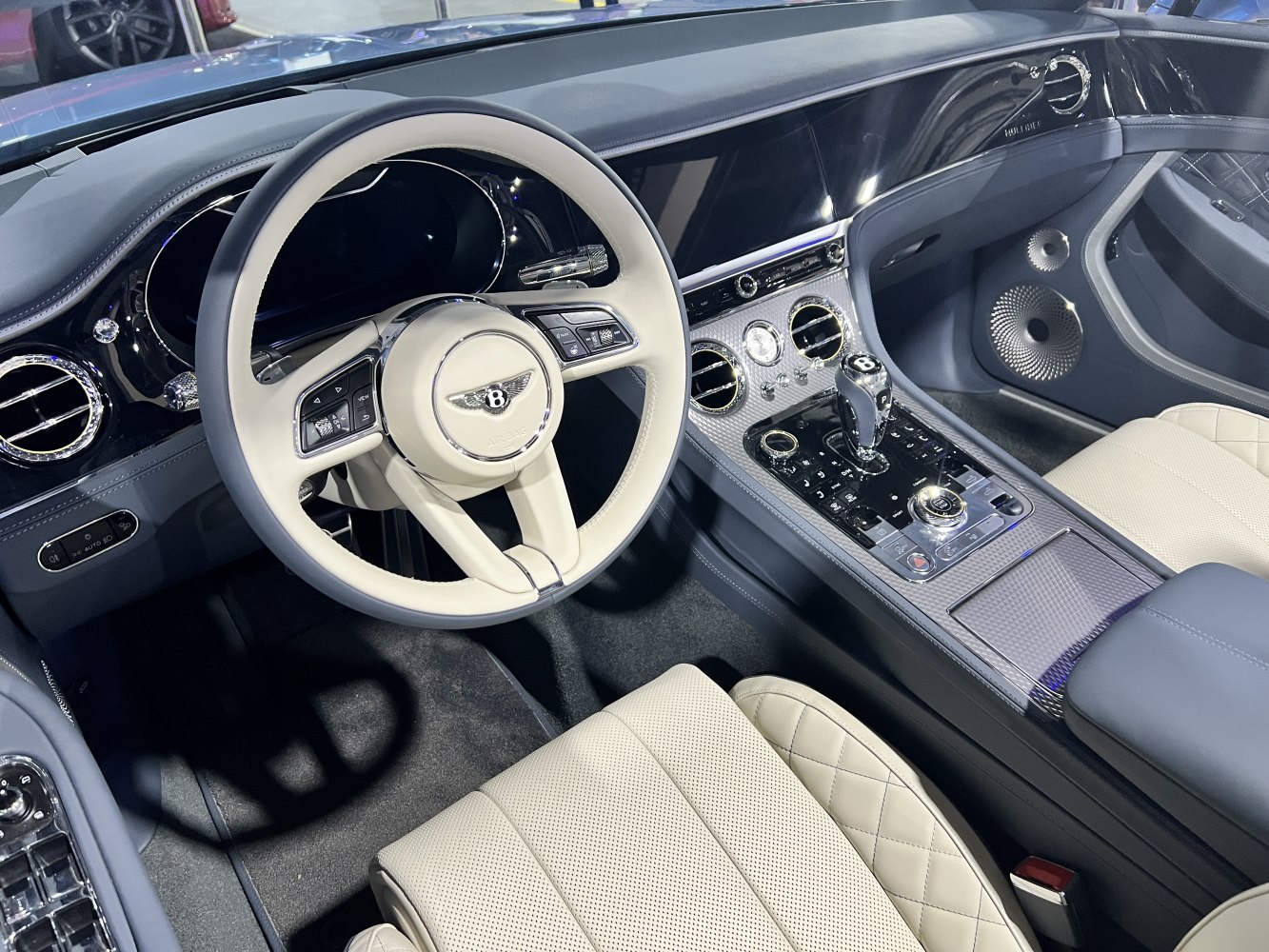Luxury steering wheel and detailed center console with quilted seats