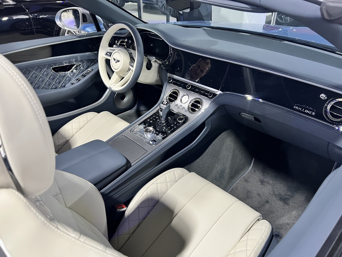 Quilted leather luxury seats with advanced infotainment dashboard and multifunction steering wheel