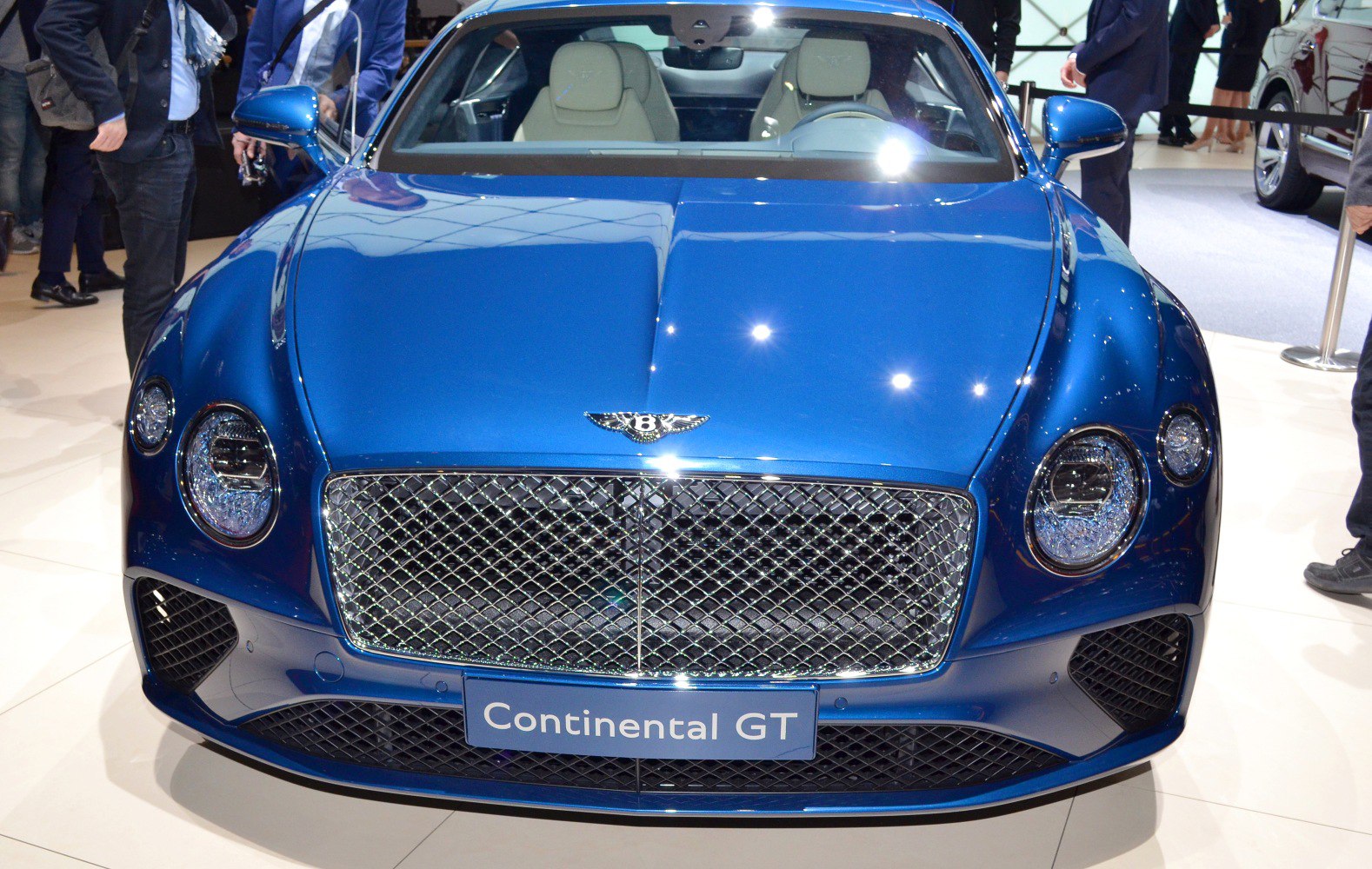 Front view with signature grille and round headlights of luxury coupe