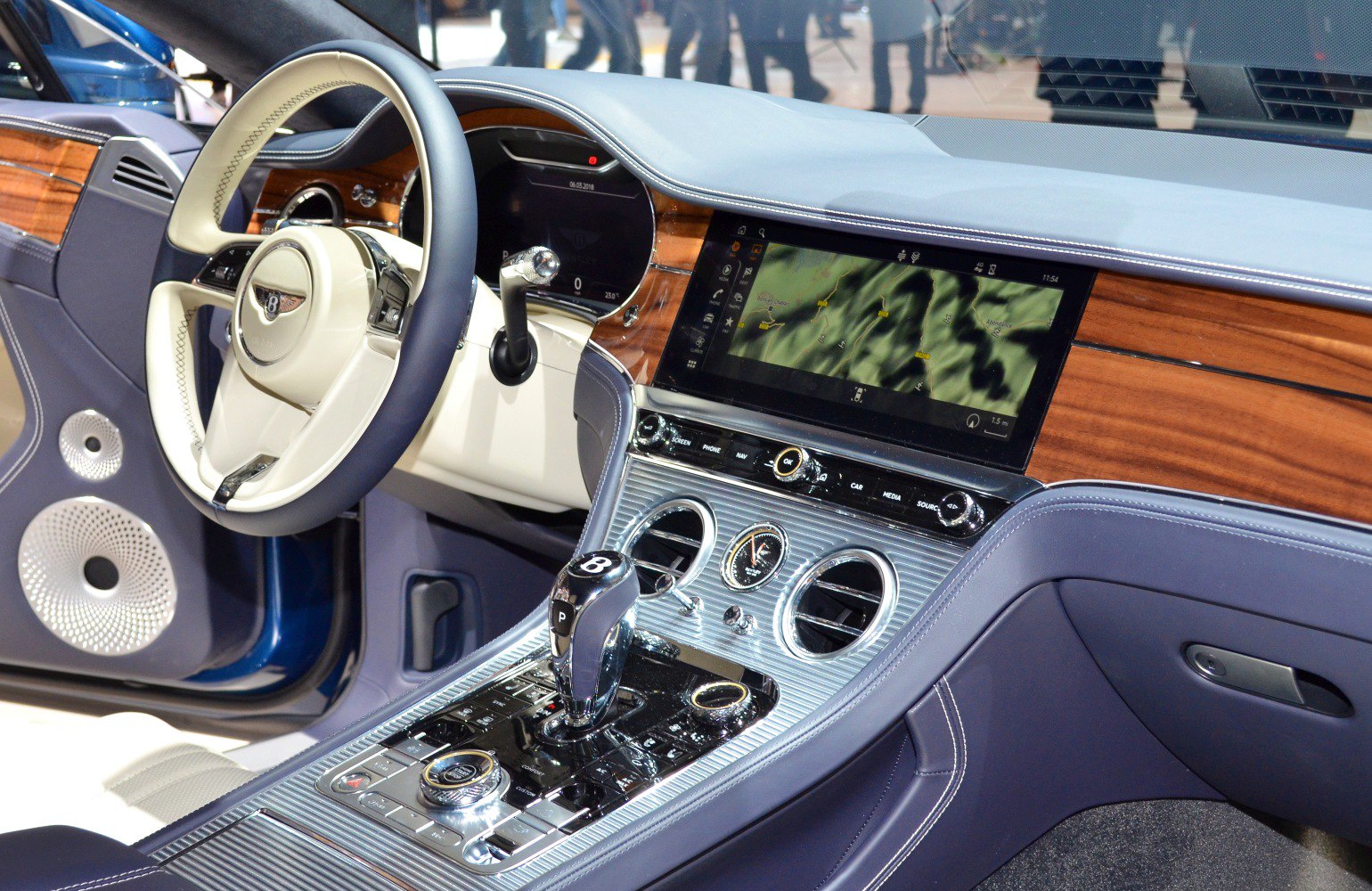Luxury car interior with wood trim and advanced infotainment system