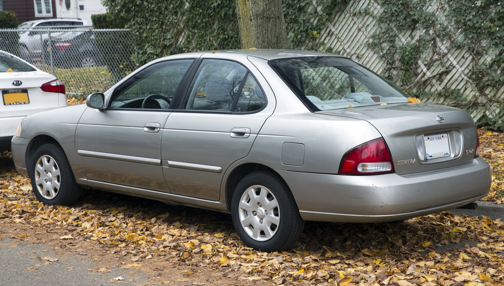 Rear side view of mid-size sedan with alloy wheels