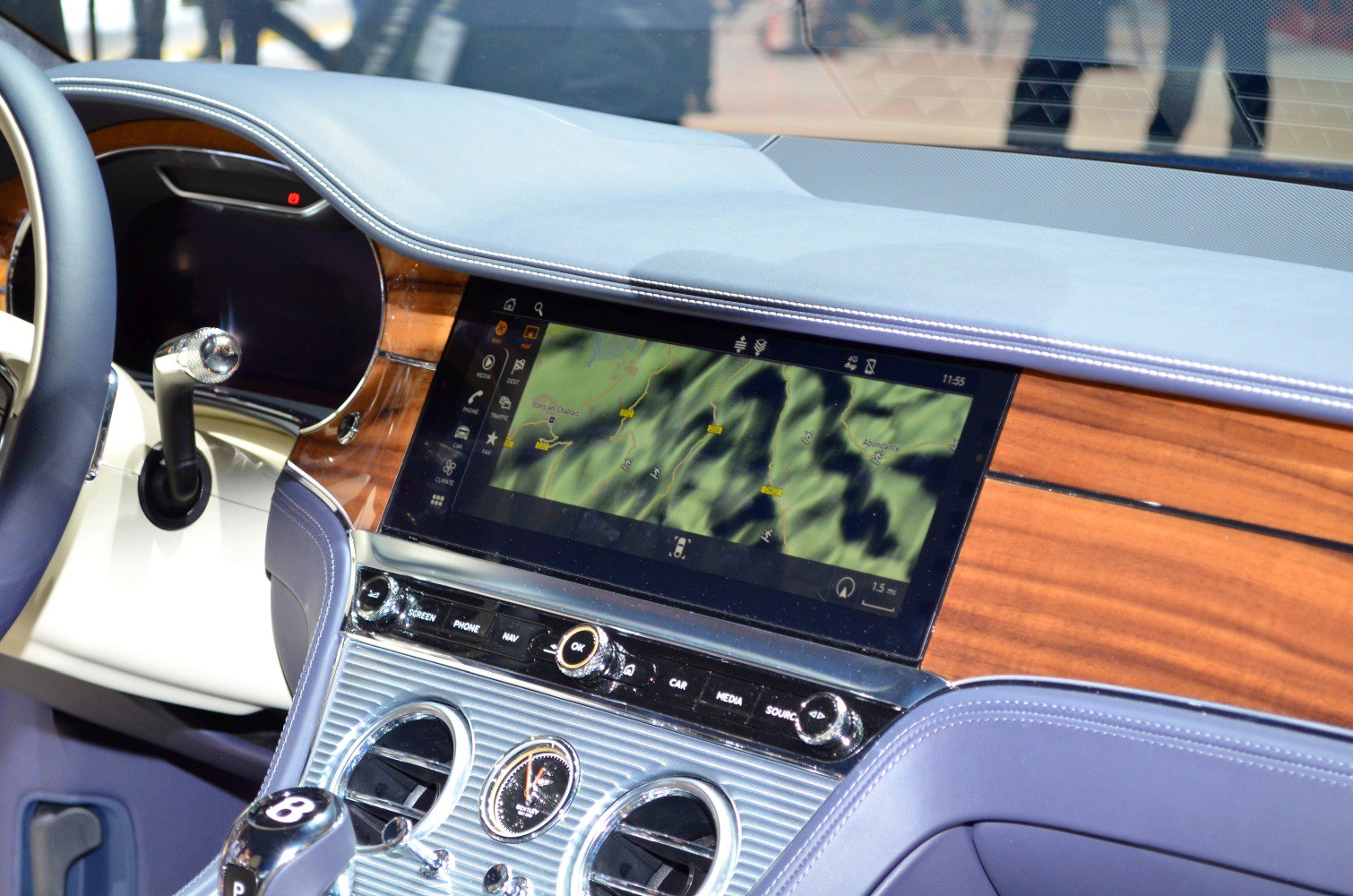 Infotainment screen and wood trim luxury car interior