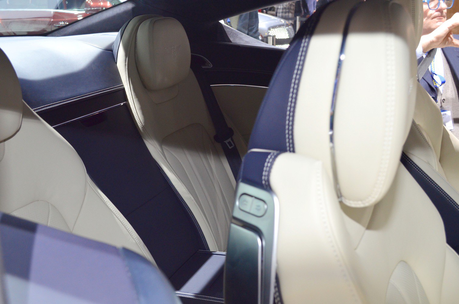 Premium leather seats with detailed stitching and seat controls